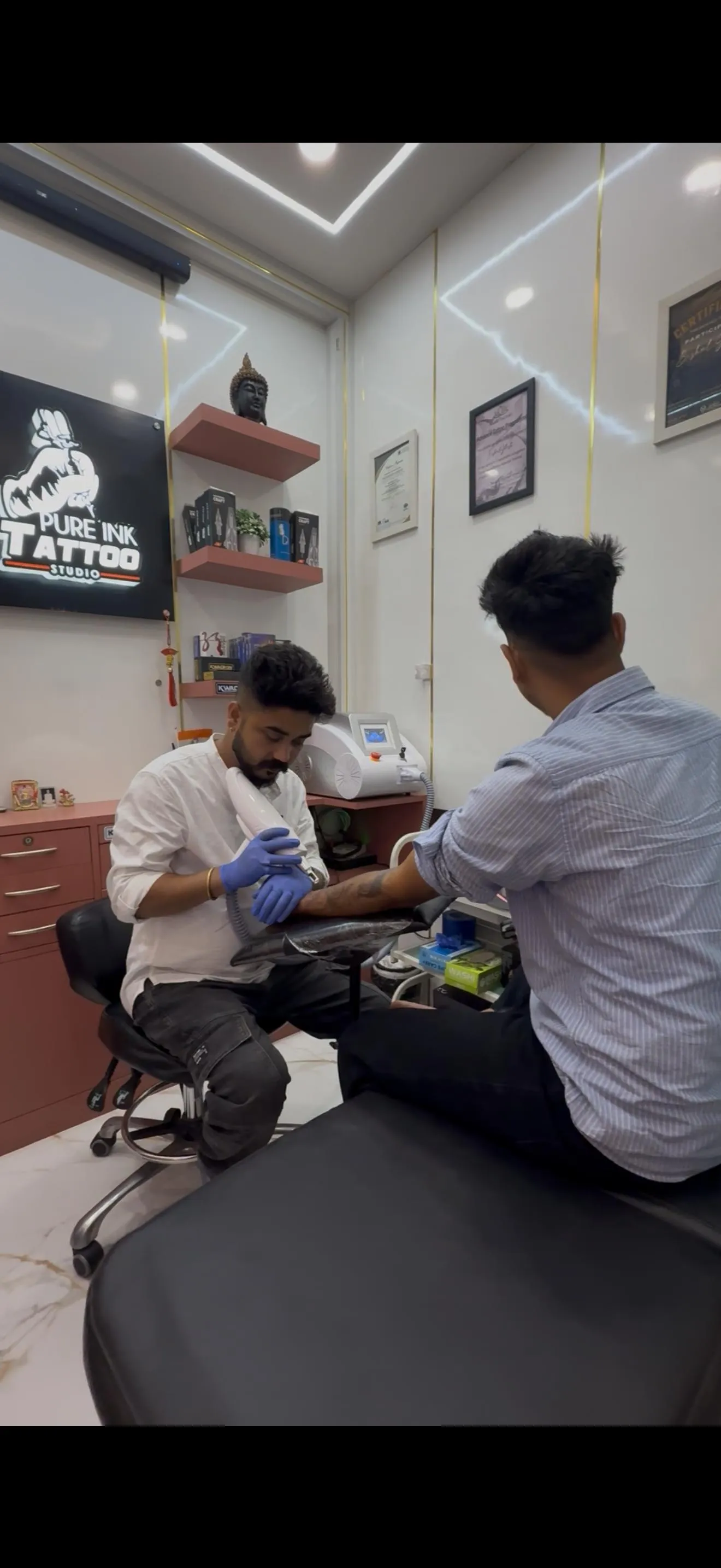 Laser tattoo pigment removal offering display - Pure Ink Tattoo Studio